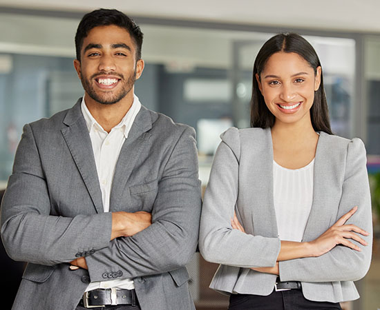 business associates in business attire smiling